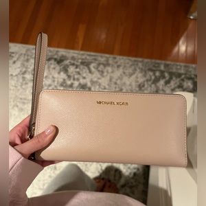 Michael Kors wristlet wallet in blush pink with gold hardware